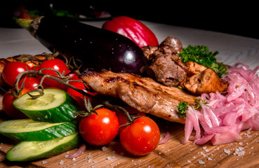 meat plate with vegetables and herbs