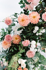 Obraz na płótnie Canvas Beautiful wedding background of fresh flowers and greenery. Wedding decorations with flowers.