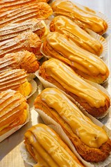 Tray of coffee eclair choux pastries
