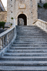 Fototapeta na wymiar View on stone stairs in old city gate in historic fortified Korcula town, Korcula Island, Dalmatia, Croatia