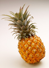 Study of a whole pineapple against white