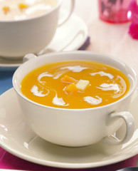 Butternut Soup with cream in a white Bowl