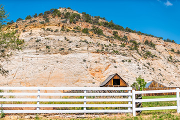 Old vintage wooden farm cabin and fence on road in Grand Staircase Escalante National Monument with...
