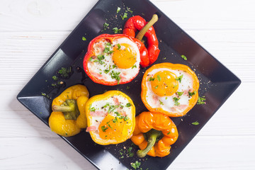 Baked pepper stuffed with bacon and eggs