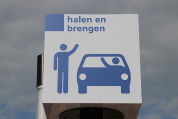 White and blue sign for bringing and picking up at the railway station Lansingerland Zoetermeer in the Netherlands