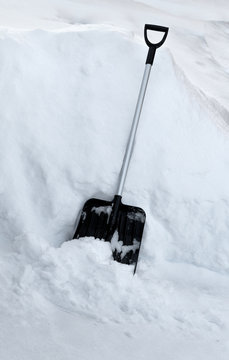 Shovel in snowdrift.