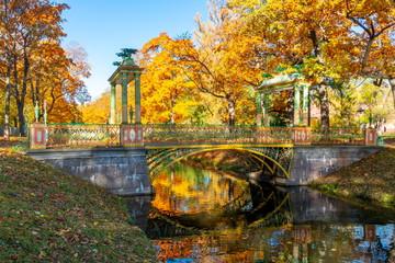 Chinese bridge during golden fall (mellow autumn) in Alexander park, Pushkin, Saint Petersburg,...