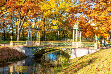 Chinese bridge during golden fall (mellow autumn) in Alexander park, Pushkin, Saint Petersburg,...