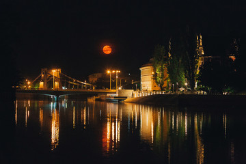 Night scene in Wroclaw. Illuminated old buildings reflect in Oder river.