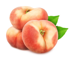 Group of ripe sweet donut peaches with leaves isolated on white background.