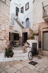 Obraz na płótnie Canvas Cisternino, Italy - August 2019: Historic center of the village of Cisternino, in Puglia on a day in August