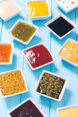 Set of different sauces in ceramic bowl
