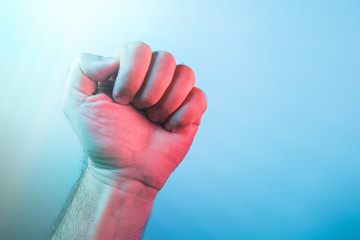 Man's hand in a clutched fist
