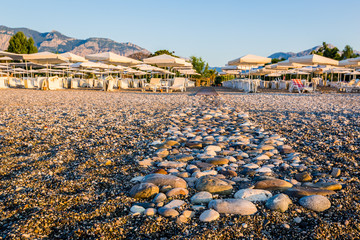 An empty pebble beach on the south coast of Turkey, Kemer in the morning