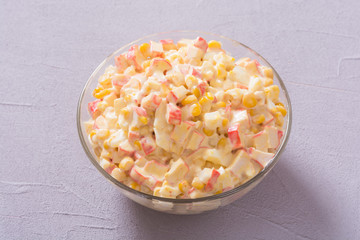 Salad with crab sticks , corn , eggs and mayonnaise