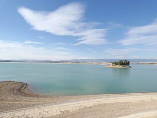 View of lake with blue sky and clouds