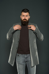 Masculine look. Brutal hipster man. Hipster wearing casual clothes. Hipster beard and stylish haircut. Bearded man trendy hipster style. Monochrome style outfit. Classy but modern. Fashion outfit