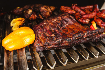 Grilled barbecue - fried pork ribs and vegetables