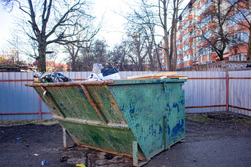 Fototapeta na wymiar green bins are on the site for garbage