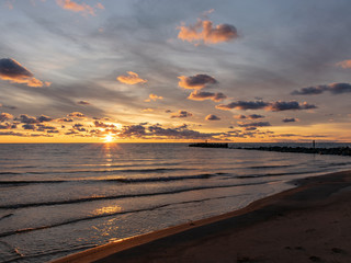 Naklejka na ściany i meble beautiful photography with sunset by the sea, beautiful and colorful sky