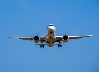 Passenger airplane in the blue sky