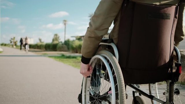 Man in wheelchair outdoors