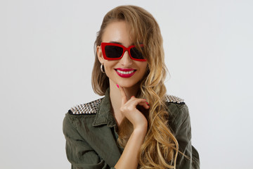 Fototapeta premium Closeup woman face in red sunglasses isolated on white background. Girl in shirt, red lips makeup. Fashion Beauty concept. Beautiful face skin and fashionable accessories. Glamour style long hair