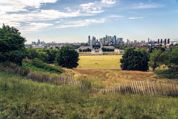 London panorama seen from Greenwich park viewpoint. Symbolic Broken fence in the foreground