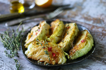 Baked cabbage slices with herbs. Vegan recipes.