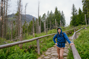 Fototapeta na wymiar man hiker hiking on trail