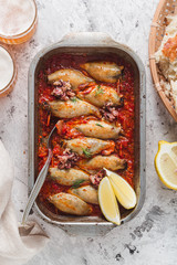 Top view of baking tray with stuffed calamari
