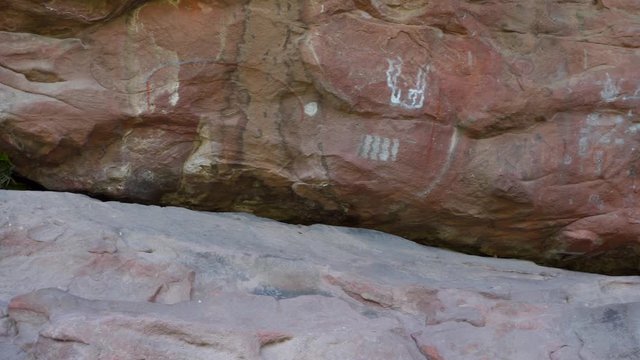 Pre-hispanic cave paintings on a rock wall in Cerro Colorado, Argentina