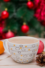 Obraz na płótnie Canvas cup of coffee on the background of a festive Christmas tree