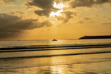 a beautiful sunrise on the beach of La Salve, in Laredo, cantabria