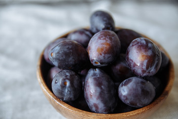 Plum in wood plate