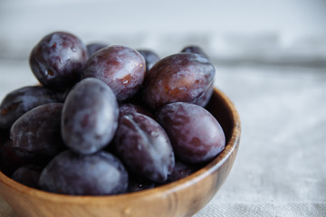 Plums macro in wood plate