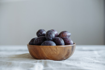 Plum in wood plate