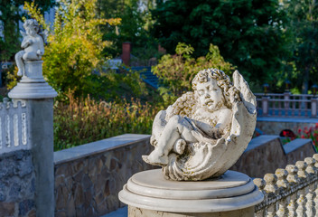 barn statue angel in the park autumn warm day