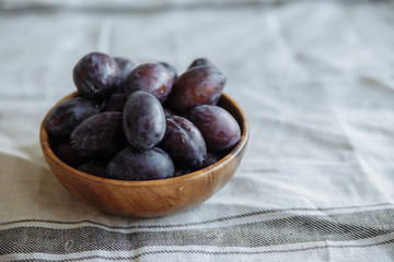 Plum in wood plate
