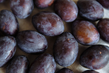 Plums macro in wood plate