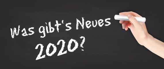 Plakat Hand schreibt auf Kreidetafel - Was gibt's Neues 2020