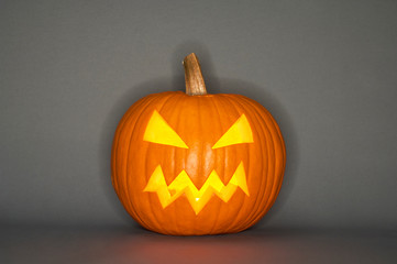 Halloween pumpkin head jack isolated on grey background
