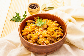 Stewed (braised) cabbage served on ethnic ceramic bowl