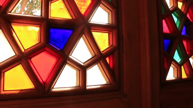 Beautiful stained glass windows with sunlight in the background