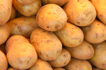 Fresh organic potatoes for sale in the market.