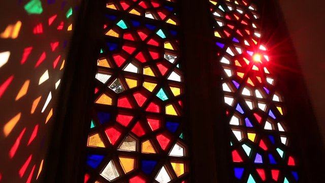 Beautiful stained glass windows with sunlight in the background