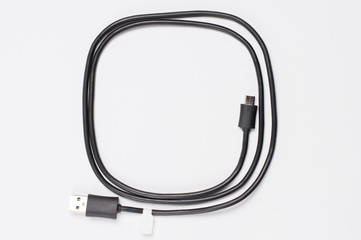black twisted usb wire on a white background