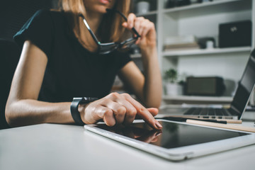Female freelancer working at home using her laptop