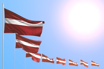 cute celebration flag 3d illustration. - many Latvia flags placed diagonal with selective focus and free space for text