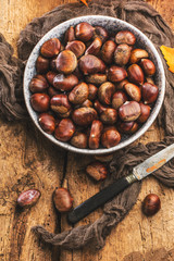 Roasted chestnuts served on an old table